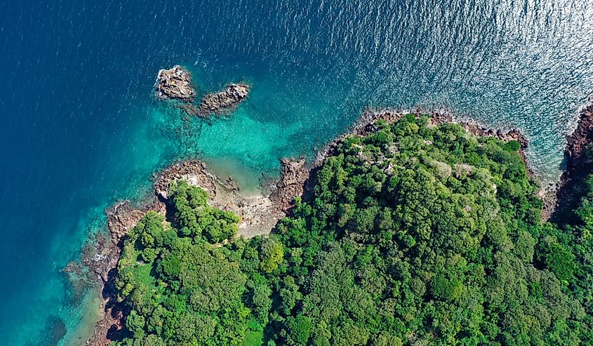 Aerial view of the Gulf of Panama. Crystal blue waters surrounding lush greenery.