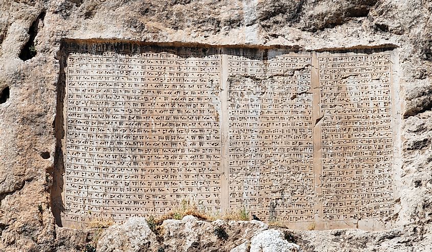 Cuneiform written into a stone tablet. 