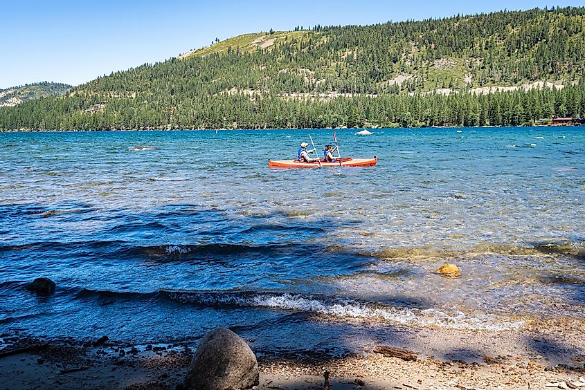  Photo of two kayakers paddling an orange boat in Donner Lake, via Chris Allan / Shutterstock.com