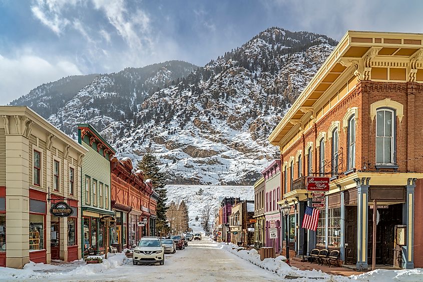 The downtown of Georgetown, Colorado, with a backdrop of snow-capped peaks.