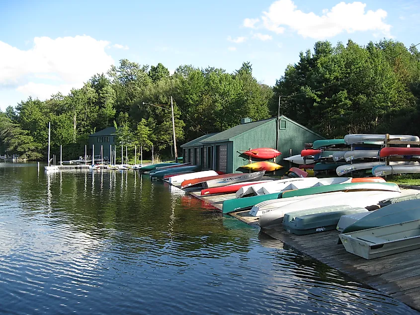 A view of small boats on a wooden deck near a lake in Eagles Mere, Pennsylvania.