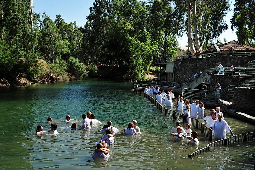 Christian pilgrims during mass baptism ceremony at the Jordan River