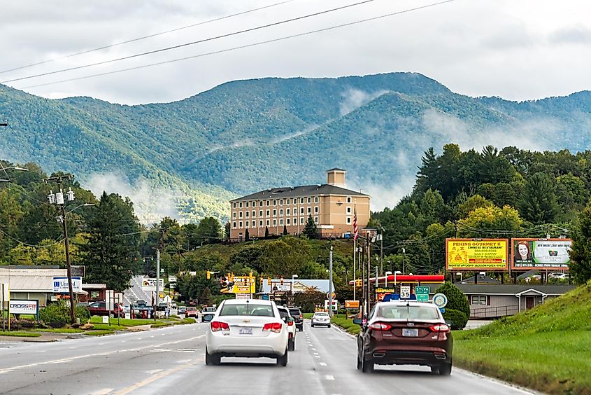 Road leading to downtown Sylva, NC, with the Blue Ridge Mountains in the cityscape