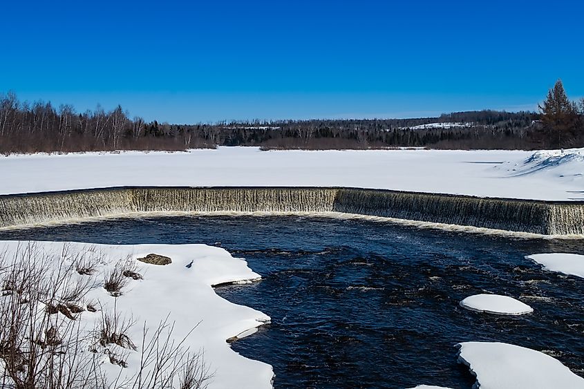 View of the waterfalls of the Mill pound in winter at the entrance of the Walter-Mckenzie park in Scotstown, Quebec