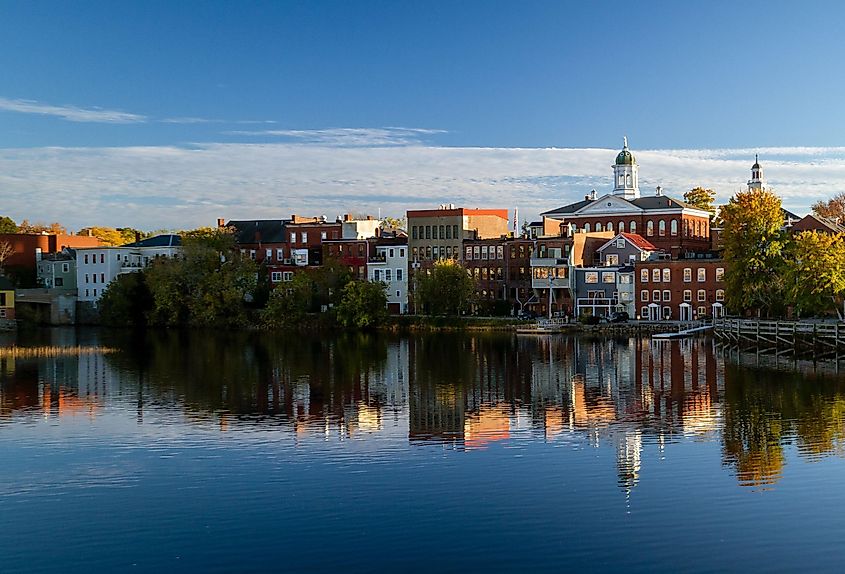 The river front buildings of Exeter, New Hampshire are seen reflected in the water