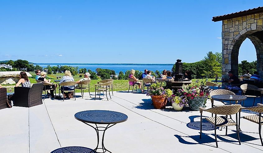 People enjoying wine tastings, relaxing atmosphere and beautiful scenic view at the famous Mari Vineyards, on Old Mission Peninsula, Traverse City.