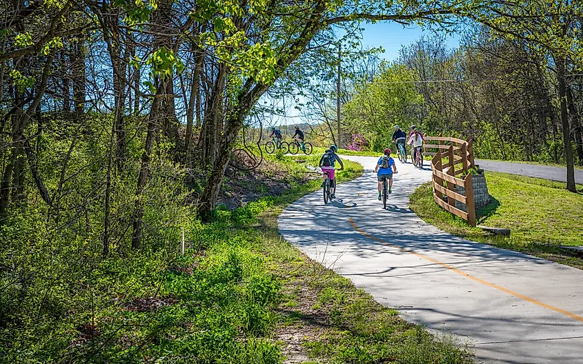 Family with kids biking on bike trail in Bella Vista, Northwest Arkansas