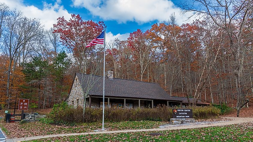 The visitor center for Catoctin Mountain Park on an autumn afternoon with the American flag, via Liz Albro Photography / Shutterstock.com