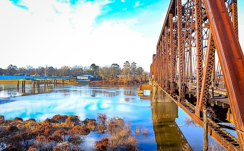 Monroe, Louisiana, rusty railroad bridge spanning the river.