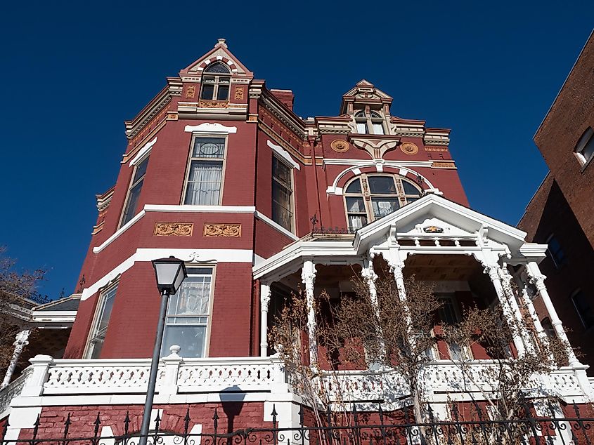 Red brick exterior with white trim on the Copper King or W.A. Clark Mansion in Butte, Montana. Editorial credit: Teresa Otto / Shutterstock.com