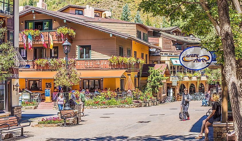 Street in Swiss style at resort town of Colorado with individuals, Vail CO.