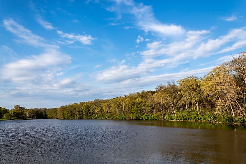 Editorial Photo Credit: Laurie A. Smith via Shutterstock. Beautiful scenic view from the West dam on Patriot`s Park Lake, near Greenville, IL. Formerly Old City Lake, constructed in 1933, is a centerpiece resource in Bond County.