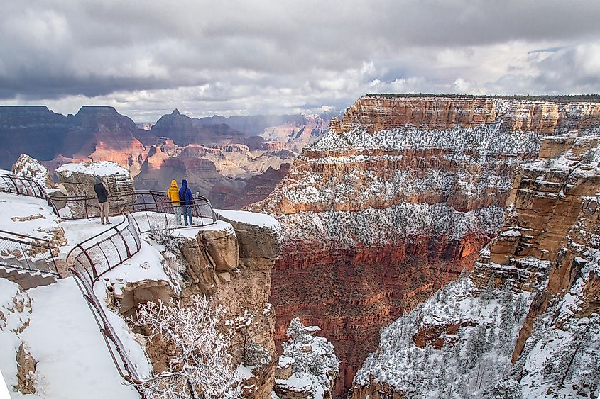 Fresh snow covering the South Rim of the Grand Canyon, highlighting layered cliffs and deep valleys in Grand Canyon National Park, Arizona