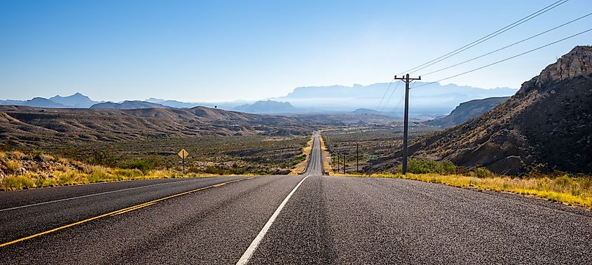 Panoramic of the road to Big Bend National Park in southwest Texas with morning haze over the mountains. Credit: Rosemarie Mosteller/Shutterstock.com