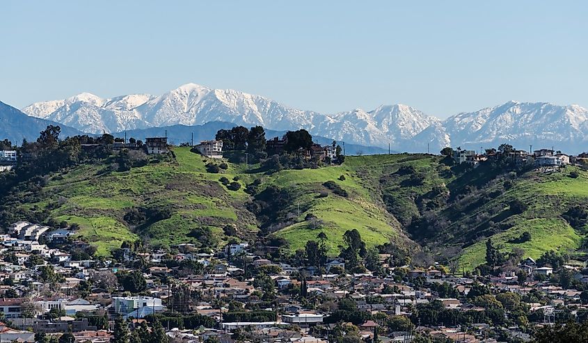 Los Angeles Mt Washington neighborhood with snow capped San Gabriel Mountains peaks in the background