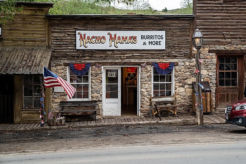 Sign for Nacho Mamas, a Mexican restaurant, in the old historic ghost town, established 1864, via melissamn / Shutterstock.com