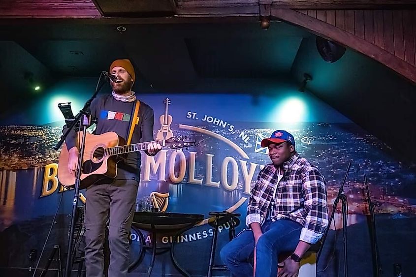 Two musicians playing a song on a bar stage