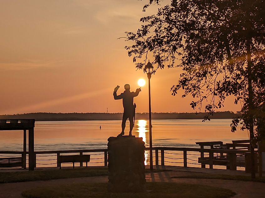Ottway Burns Statue at sunrise at the Swansboro Bicentennial Park, Swansboro, North Carolina.