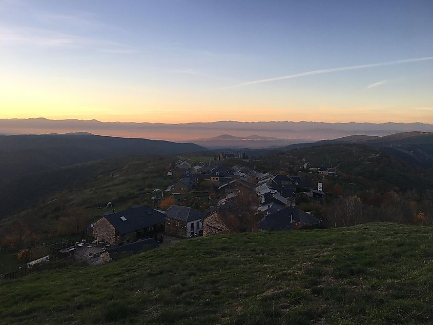 A small mountain village watches the final minutes of a beautiful pastel sunset. 