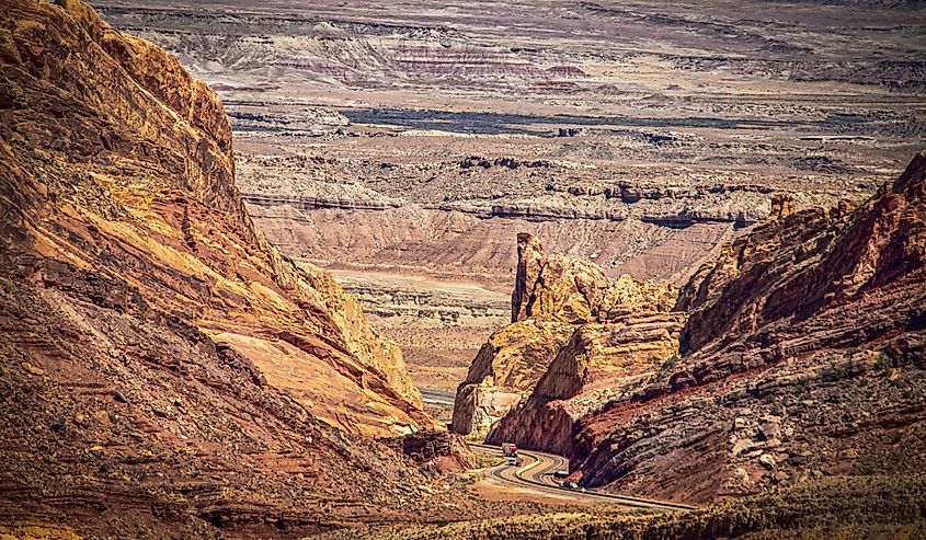 Transcontinental Highway 50 in the USA winding through the dramatic San Rafel Canyon of Utah with canyonlands stretching as far as the eye can see in the distance