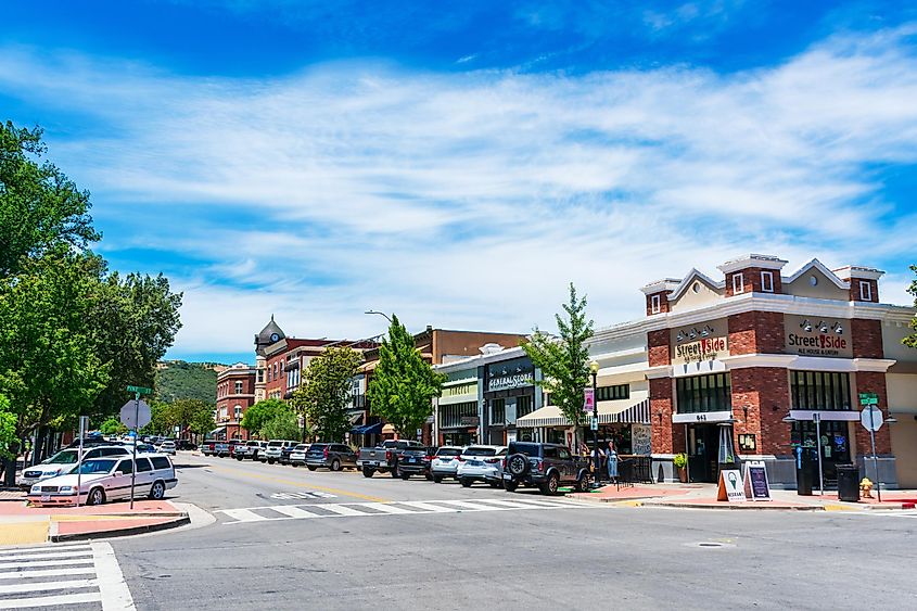 Cars parked in Downtown Paso Robles along 12th street with historic Clock Tower Acorn Building in background