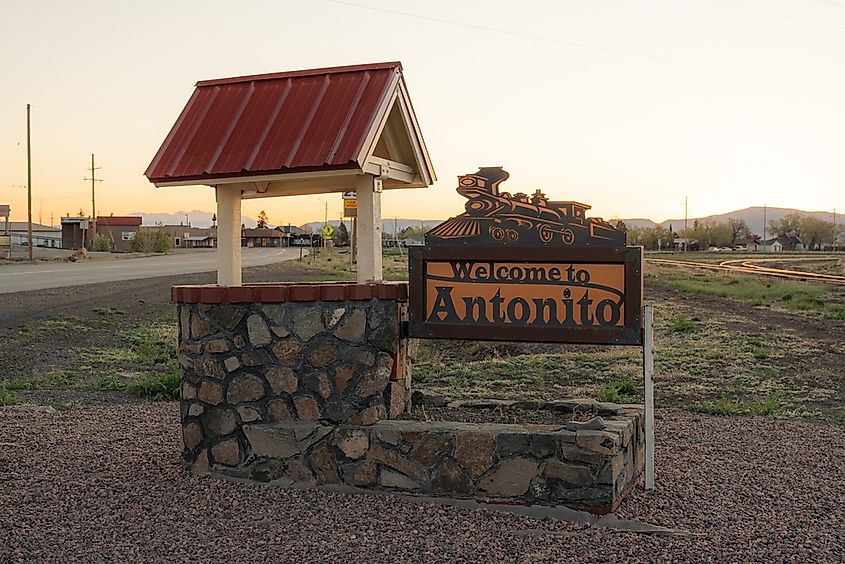 A welcome sign to Antonito at sunrise.
