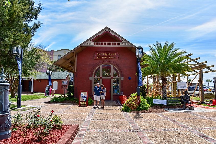 A couple standing in front of the Welcome Center at Amelia Island, Florida, set off to explore the town.
