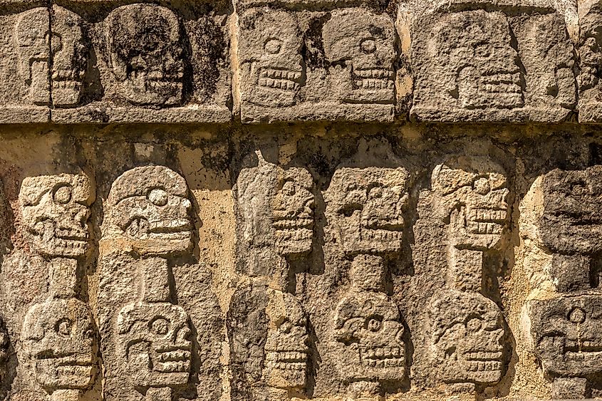 Close-up view of carved skulls in a Mayan temple in Chichen Itza, Mexico, America
