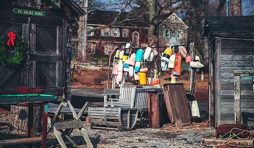 The old rustic shed on the left and bunch of colorful boat fenders in the middle in Southport, Fairfield, Connecticut.