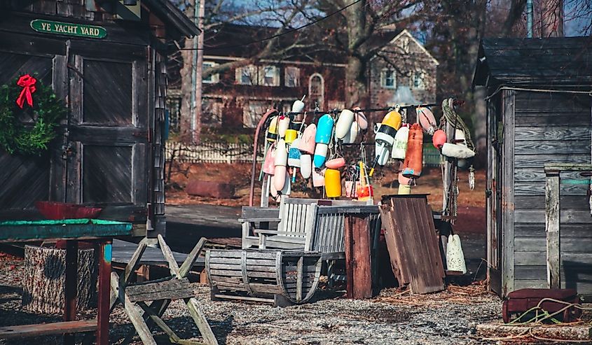 The old rustic shed on the left and bunch of colorful boat fenders in the middle in Southport, Fairfield, Connecticut.