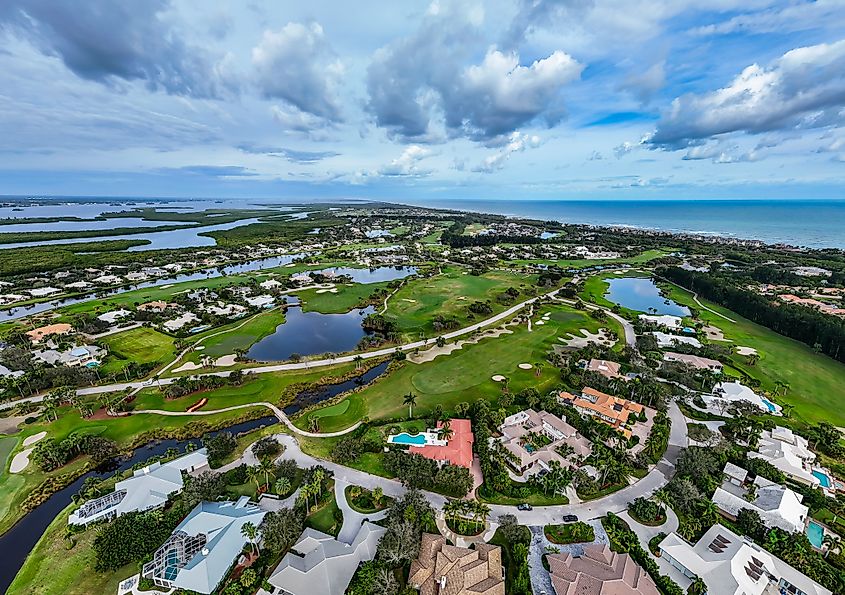 Aerial view of the Wabasso Beach barrier island near Vero Beach, Florida, showing a luxury golf community along the coast