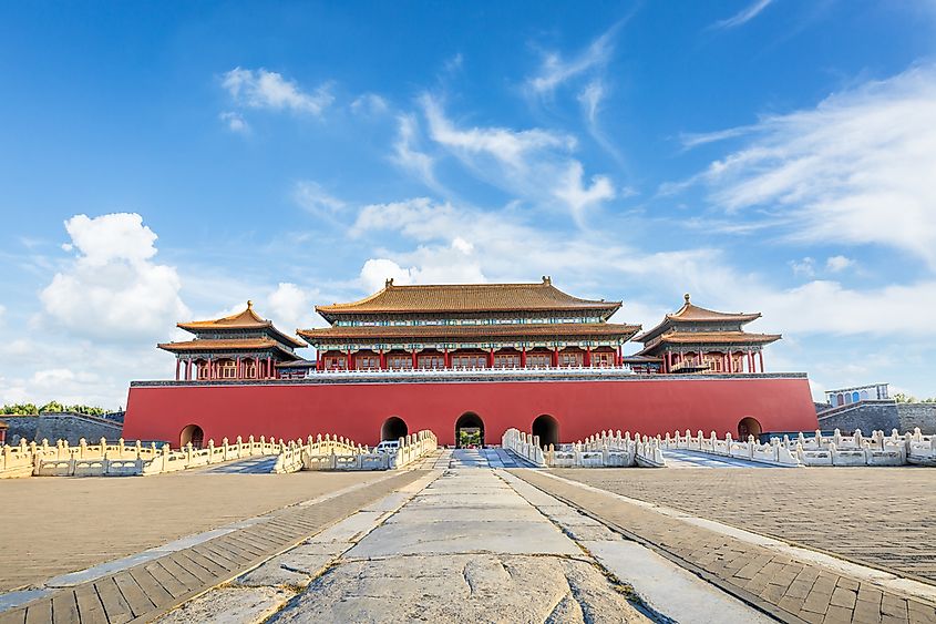 The Forbidden City in Beijing viewed from above, showing the symmetrical layout and golden roof tiles.