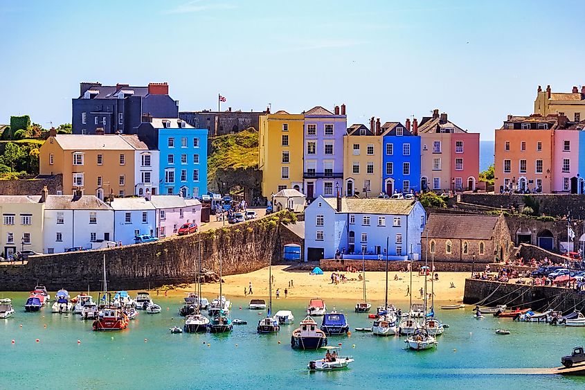 Beautiful summer sunshine and warm weather drew visitors to the beach Tenby, Wales.