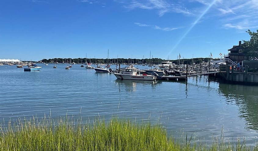 Looking across the bay at the docked boats on Shelter Island. In front is the fire rescue speed boat that is tied up onto the pier.