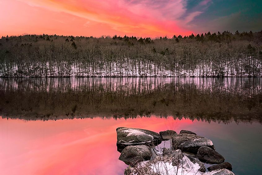 Vibrant winter landscape of Webb Mountain and water reflection on Lake Zoar in Monroe, Connecticut.