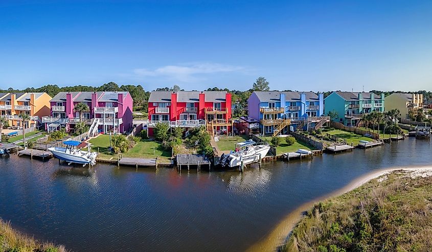 Facade of colorful houses along the bay in Navarre, Florida scenic community.