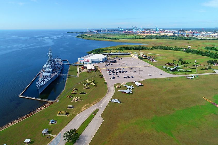 USS Alabama Battleship BB-60 Mighty A on display at Memorial Park in Mobile, Alabama, with flags and military exhibits nearby