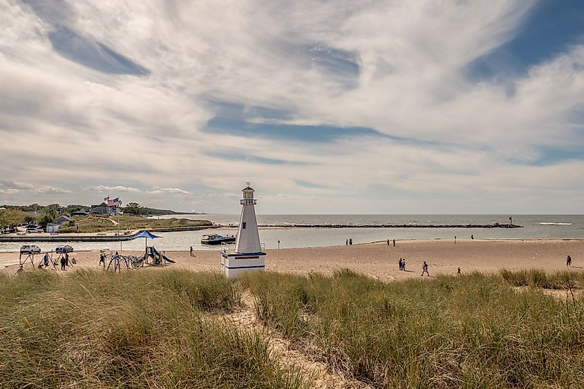 People explore beach and harbor area in New Buffalo, Michigan