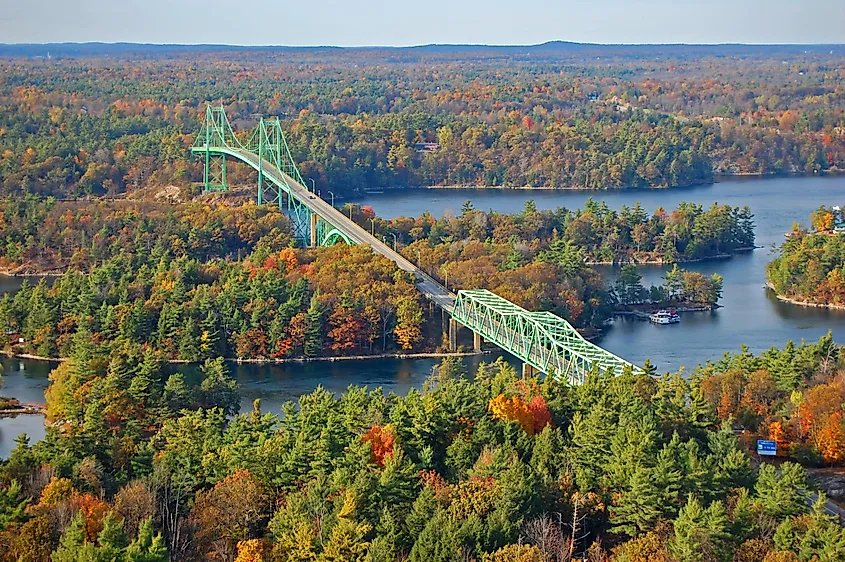 Thousand Islands Bridge across St. Lawrence River in fall in Thousand Islands National Park.
