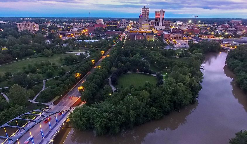 Aerial view of downtown Fort Wayne with bridge at sunset. 