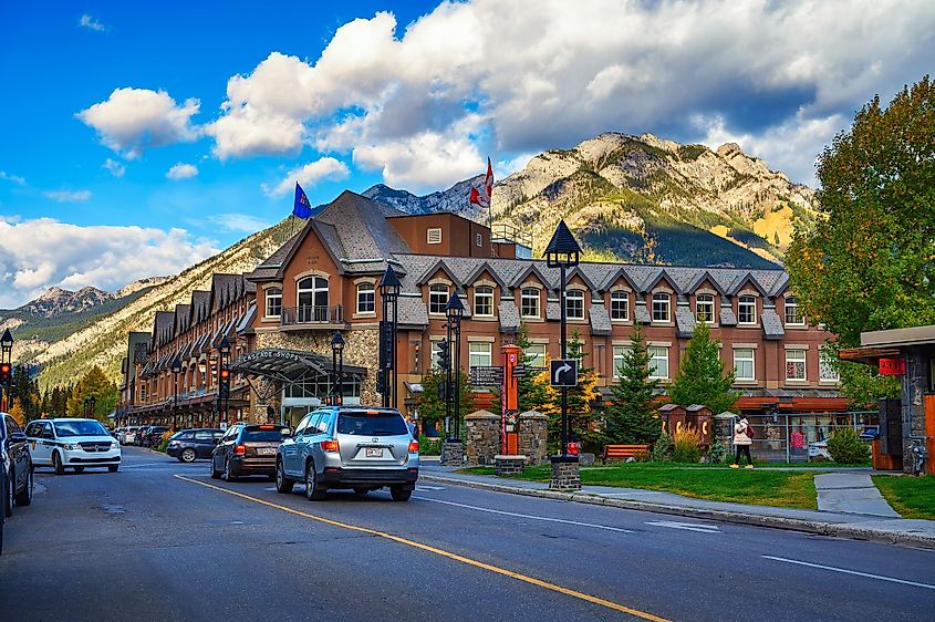 Scenic street view of Banff with cars and Cascade Shops Shopping Mall