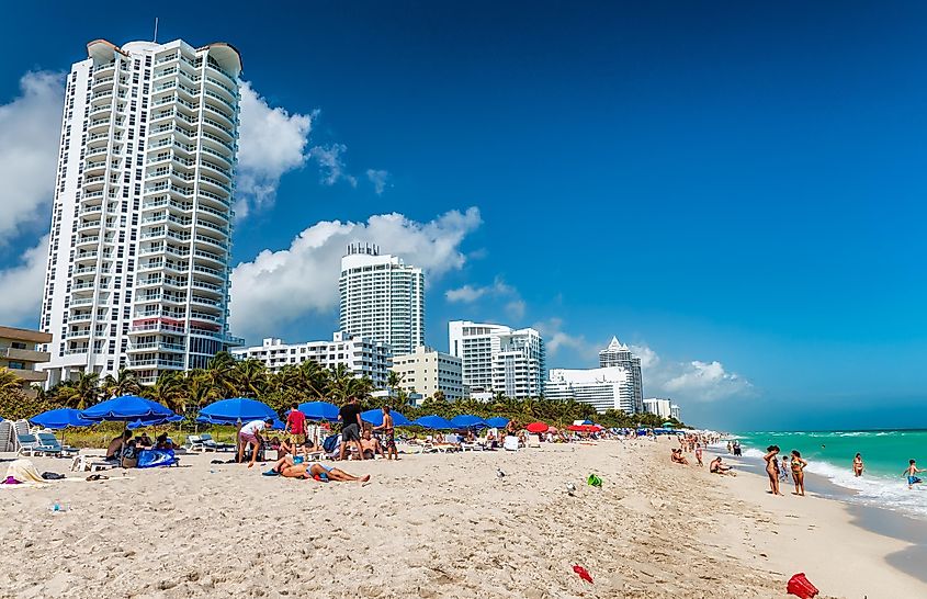 Beachgoers enjoying a sunny day on Miami Beach