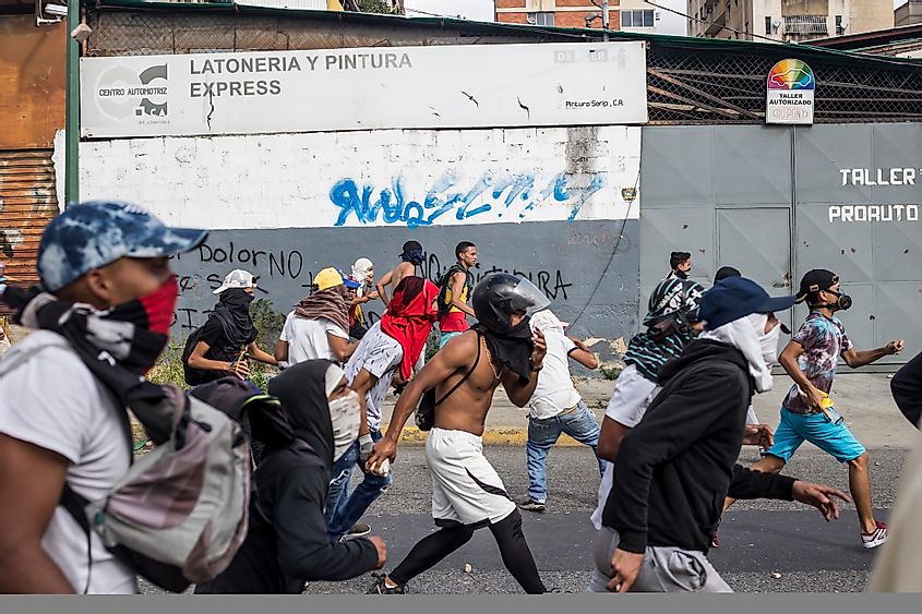 Demonstrators clash with the police after attending rally in support of Venezuela's National Assembly President Juan Guaido.