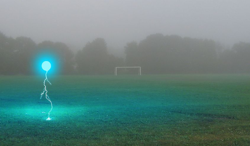 Ball lightning on a rural field in the rain.