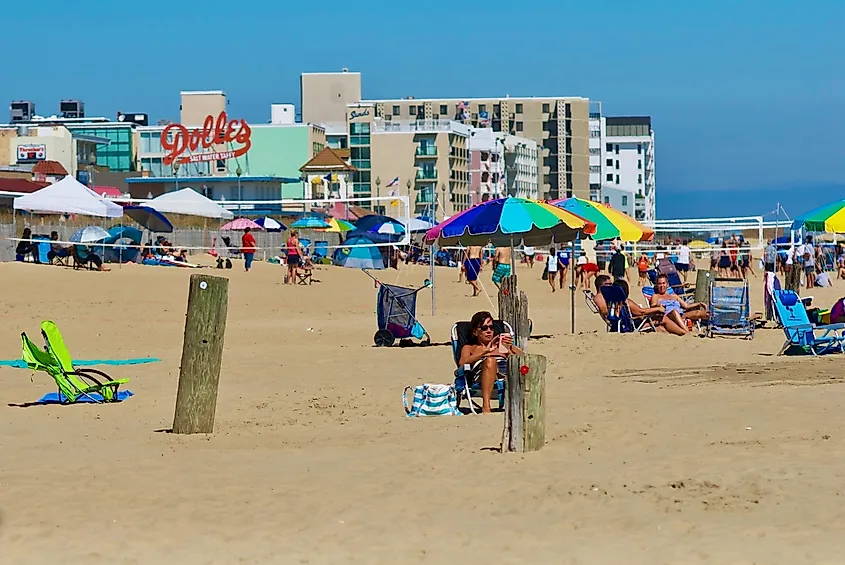 Vacationers enjoy a day by the beach in Rehoboth Beach, Delaware