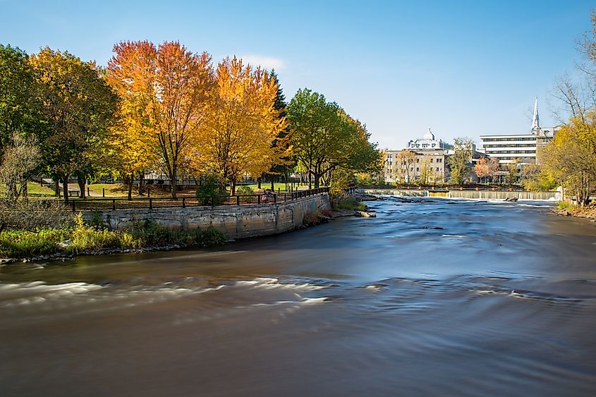 Slow motion streaming water. Waterfalls in L'Assomption river, Joliette, Quebec, Canada, city of Lanaudiere area.
