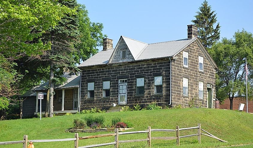 Front and western end of the Phillip Henninger House, located at 5757 Broadview Road (State Route 176) in Parma, Ohio, United States.