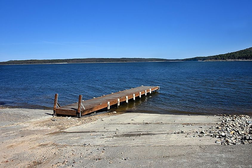 Rustic, wooden dock extends out into Lake Norfork, in Northern Arkansas. 