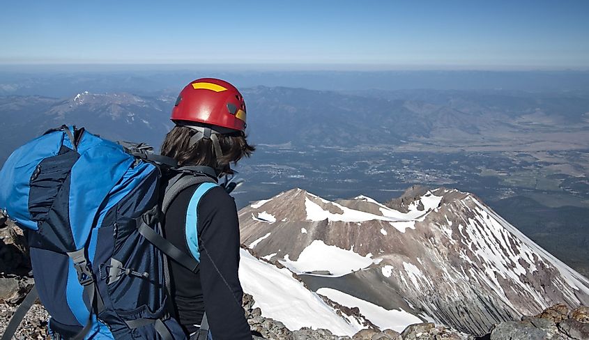 Mountain climber looks out at Shastina from Mount Shasta