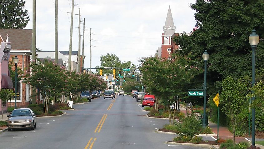  Photo of Seaford, Delaware's High Street with cars and church in the background.